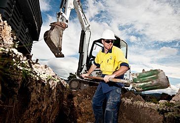 Where did the trial rollout of the NBN begin in 2010?