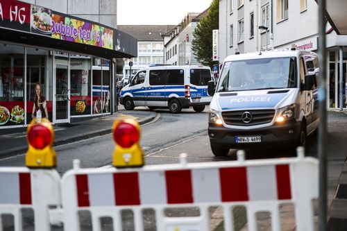 Police cars sit at a cordon early Saturday, Aug. 24, 2024, after several people were killed and injured in an attack at the Solingen's 650th anniversary celebrations late Friday.  