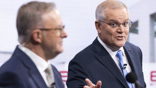 Australian opposition leader Anthony Albanese and Australian Prime Minister Scott Morrison debate on live television ahead of the federal election, during the second leaders' debate of the 2022 federal election campaign at the Nine studio.