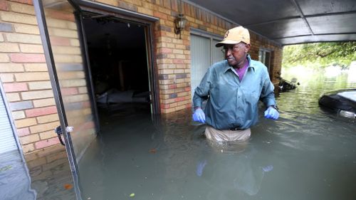 Flood waters began to recede on Saturday (local time), making damage more apparent. (AP)