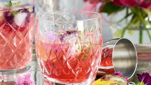 Rhubarb with raspberry and rosehip cocktail with flower power ice