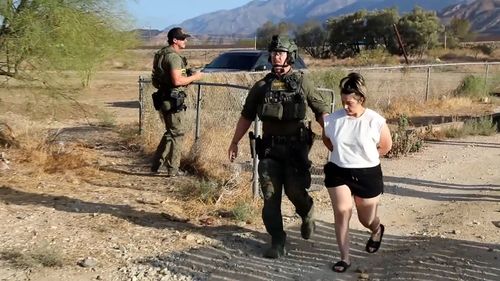 Rebecca Haro is seen being arrested at her home on August 22 in Cabazon, California