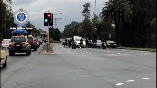They surrounded the car, smashing on the windscreen and kicking the side of the vehicle. Picture: NSW