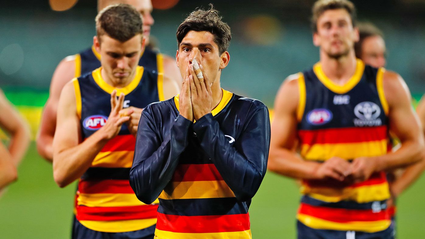 Shane McAdam of the Crows looks on dejected