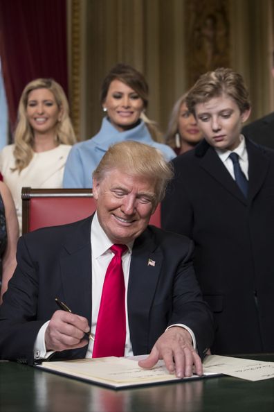 President Donald Trump signs his cabinet nominations into law, in the Presidents Room of the Senate, at the Capitol in Washington in 2017.