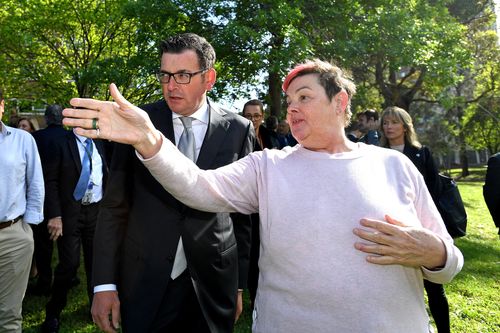 An angry local resident directs the attention of Victorian Premier Daniel Andrews to a drug overdose scene. (AAP)