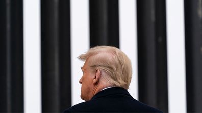 Then-President Donald Trump tours a section of the U.S.-Mexico border wall in Alamo, Texas.