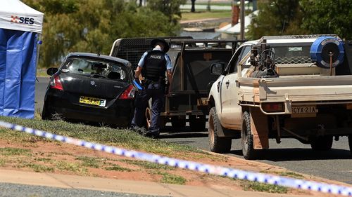 The black suzuki swift car with blown out rear window where a woman and a man were shot on Bokhara Street in Lake Cargelligo.