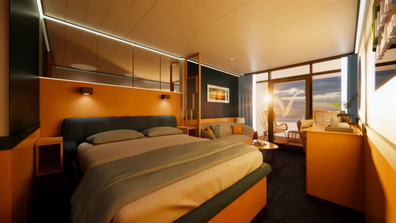 A shot of the bedroom of the balcony cabin aboard the ship.