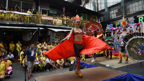 Inmates bring Christmas cheer to Philippine prison with mock beauty pageant