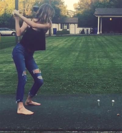 <b>Victoria's Secret model Behati Prinsloo showed she's no slouch off the golf tee after cracking a couple of drives on her backyard driving range.</b><br/><br/>The 25-year-old posted a video of herself on Instagram displaying the type of swing which would be perfectly at home on the LPGA.<br/><br/>Swinging freely on each attempt, the wife of rocker Adam Levine, hits each ball straight down the line and into the protective net.<br/><br/>Click through to decide whether she should take up a new career or stick to the fashion runways. <br/>