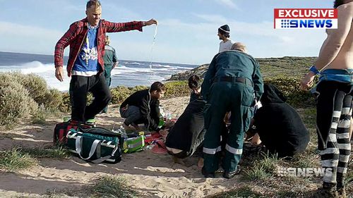 The surfer was given first aid before paramedics arrived. (9NEWS)