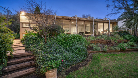 Rare riverfront property in Melbourne's Kew sells under the hammer for $5million.