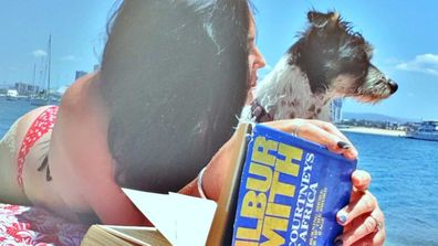 Schapelle Corby on the Gold Coast beach with her dog Lucille.