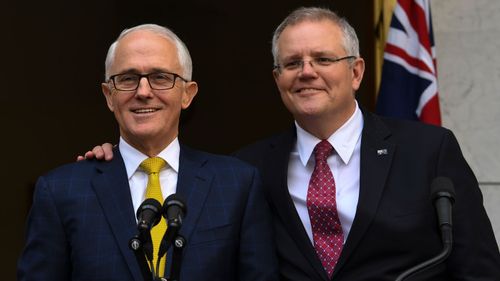 Morrison smiles alongside Turnbull days before he was ousted as leader of the Liberal Party.