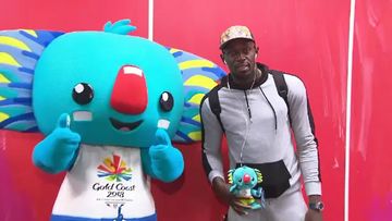 Usain Bolt with Commonwealth Games mascot Borobi on the Gold Coast. (9NEWS)