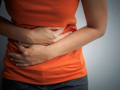Woman with gastro / stomach pains