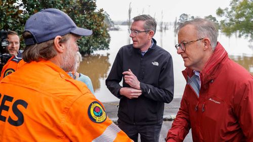 Anthony Albanese and Dominic Perrottet meeting with SES volunteers in the Sydney suburb of Richmond.