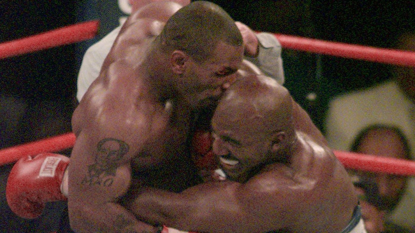 Mike Tyson bites Evander Holyfield 