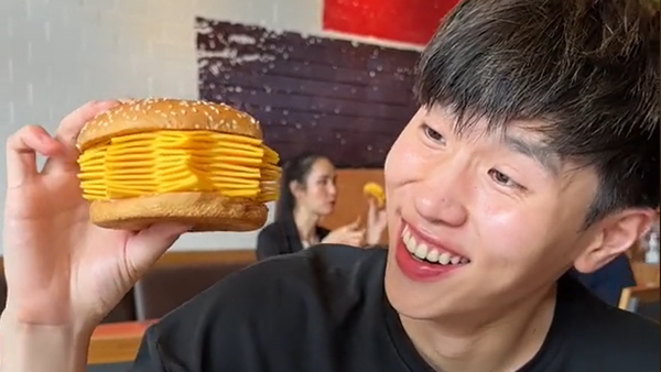 Thailand local tries 20-slice cheese burger at Burger King.
