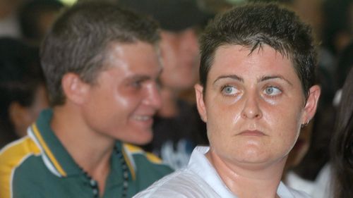 Australian Renae Lawrence, right, and Scott Rush, left, join other prisoners to celebrate Christmas at Kerobokan prison in Bali, Indonesia, Monday, Dec. 18, 2006.