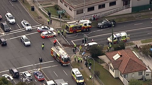 A woman is trapped and children have been injured in the bus crash at Peakhurst.