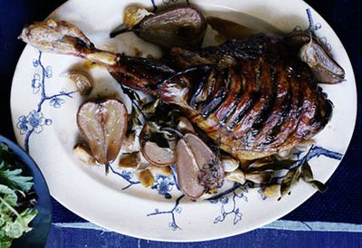 Slow-roasted leg of lamb with rosé pears and cloves of garlic