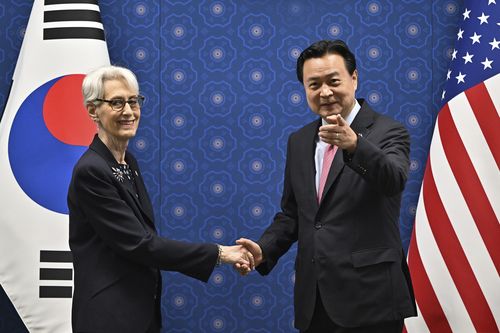 South Korea's First Vice Foreign Minister Cho Hyun-dong, right, shakes hands with U.S. Deputy Secretary of State Wendy Sherman during their meeting at the Foreign Ministry in Seoul Tuesday, June 7, 2022 