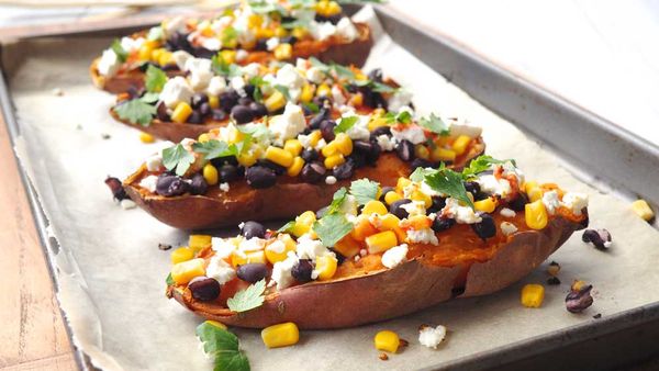 Loaded sweet potatoes with feta, corn and black beans