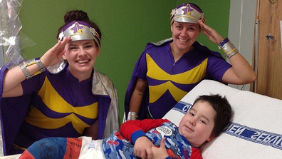 In hospital being visited by Starlight Children's Foundation workers.