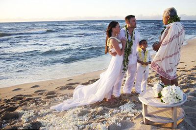 Of course Megan was going to make a babelicious bride!<P><br/>The photogenic couple wed on the beach in Hawaii, with Brian's young son on hand to deliver the rings.