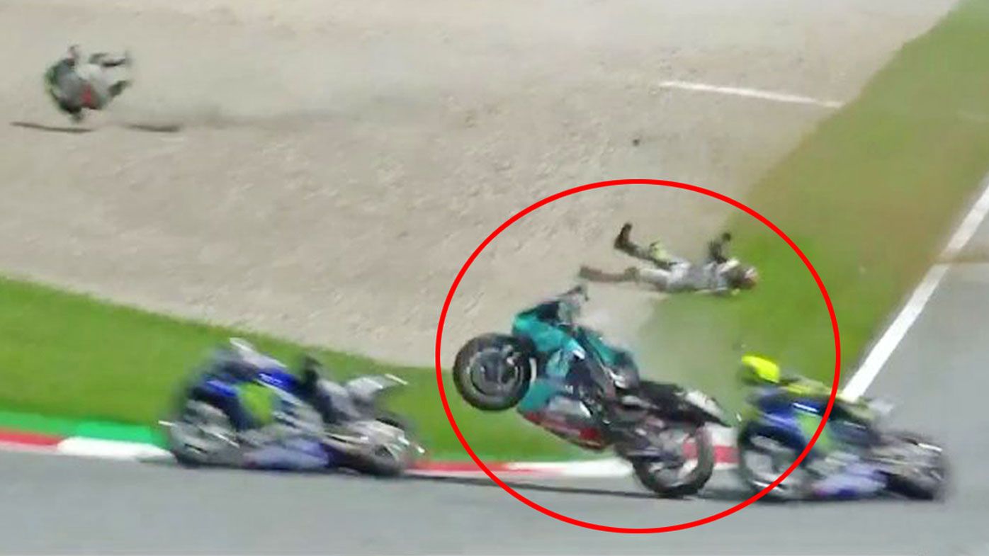 Valentino Rossi narrowly escaped being wiped out side-on by a flying bike