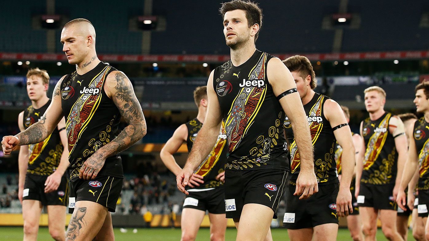 Dustin Martin of the Tigers (2L) and Trent Cotchin of the Tigers (C) look dejected after defeat in the round 17 AFL match between Richmond Tigers and Collingwood Magpies at Melbourne Cricket Ground on July 11, 2021 in Melbourne, Australia. (Photo by Daniel Pockett/AFL Photos/via Getty Images)