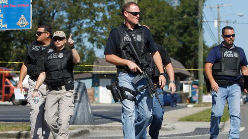 Florida suburb gripped by fear of serial killer gunman