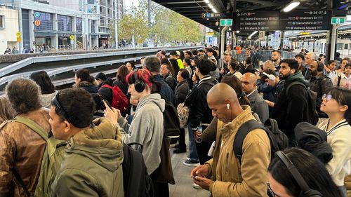 Commuters crowd onto platforms at Central Station on Wednesday afternoon
