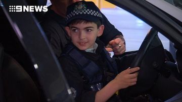 Sy becomes police officer for a day