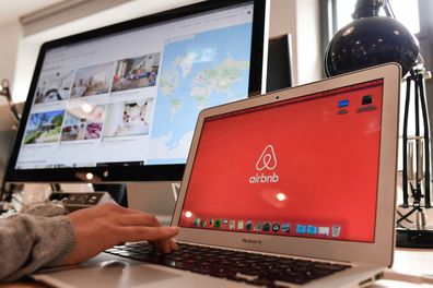 April 16, 2018, Germany, Berlin: The Airbnb logo can be seen on various screens in the office of Airbnb Deutschland GmbH on Neue Schönhauser Strasse.  Airbnb is a community marketplace for booking and renting accommodation.  Private and commercial landlords rent apartments with the support of agencies.  Photo: Jens Kalaene/dpa-Zentralbild/dpa (Photo by Jens Kalaene/picture alliance via Getty Images)