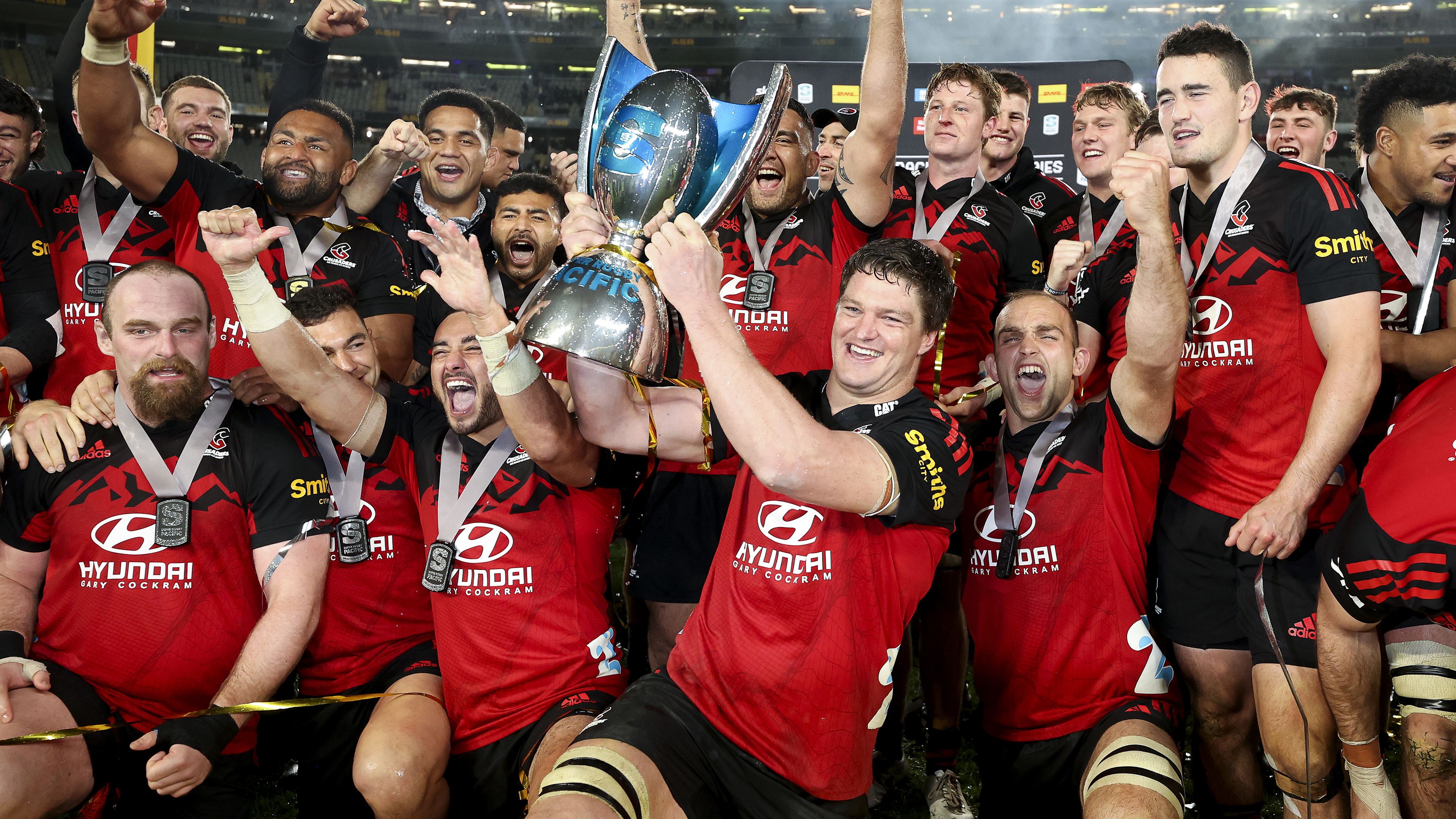 Scott Barrett of the Crusaders holds the Super Rugby Pacific trophy after winning the 2022 Super Rugby Pacific Final.