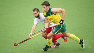 Simon Orchard of Australia battles for the ball with Nick Catlin of England during the men's semi-final match at Glasgow. (Getty)