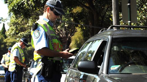 NSW Police conduct a random breath test operation on Moore Park Road, Sydney