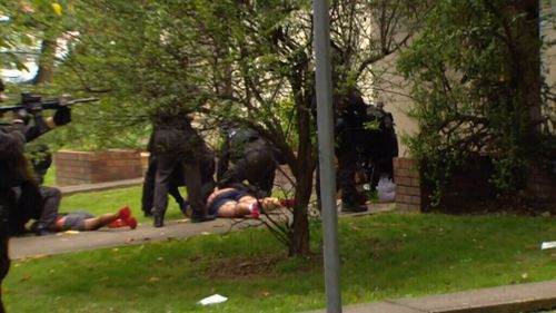 Police have stormed a unit block in Arncliffe. (9NEWS)