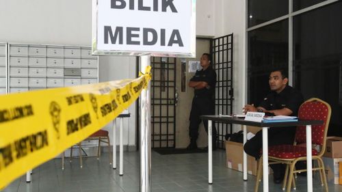 Malaysian police officers guard outside the media room of Shah Alam court house in Shah Alam, outside Kuala Lumpur. (AP)