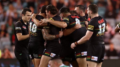 The Panthers celebrate their victory over the Rabbitohs.