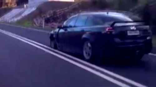 Dashcam footage captures car speeding past with just three wheels. (A Current Affair)
