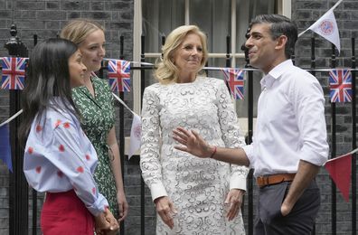 Prime Minister Rishi Sunak, gestures as he speaks to US First Lady Jill Biden, Finnegan Bide and his wife Akshata Murty , left, as they attend the Big Lunch party at Downing Street in London Sunday, May 7, 2023. 