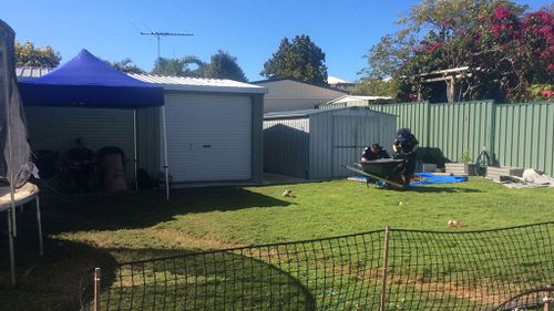 The backyard where police are conducting investigations into the homicide. (Queensland Police)