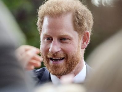 Prince Harry meets people after viewing the floral tributes for the late Queen Elizabeth II outside Windsor Castle, in Windsor, England, Saturday, Sept. 10, 2022. (AP Photo/Martin Meissner)
