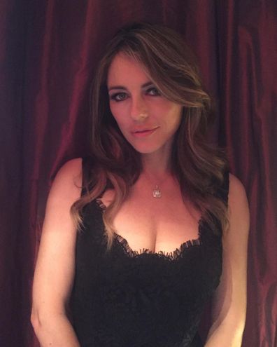 Liz Hurley wears Versace dress