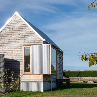It looks like a tiny Tassie shed from the outside, but inside it is a designer home