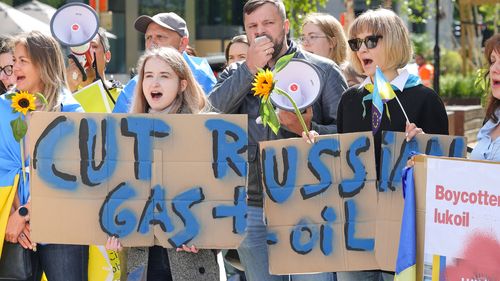 Ukrainian demonstrators demand an embargo on Russian oil during a protest in front of EU institutions prior to an extraordinary meeting of EU leaders.